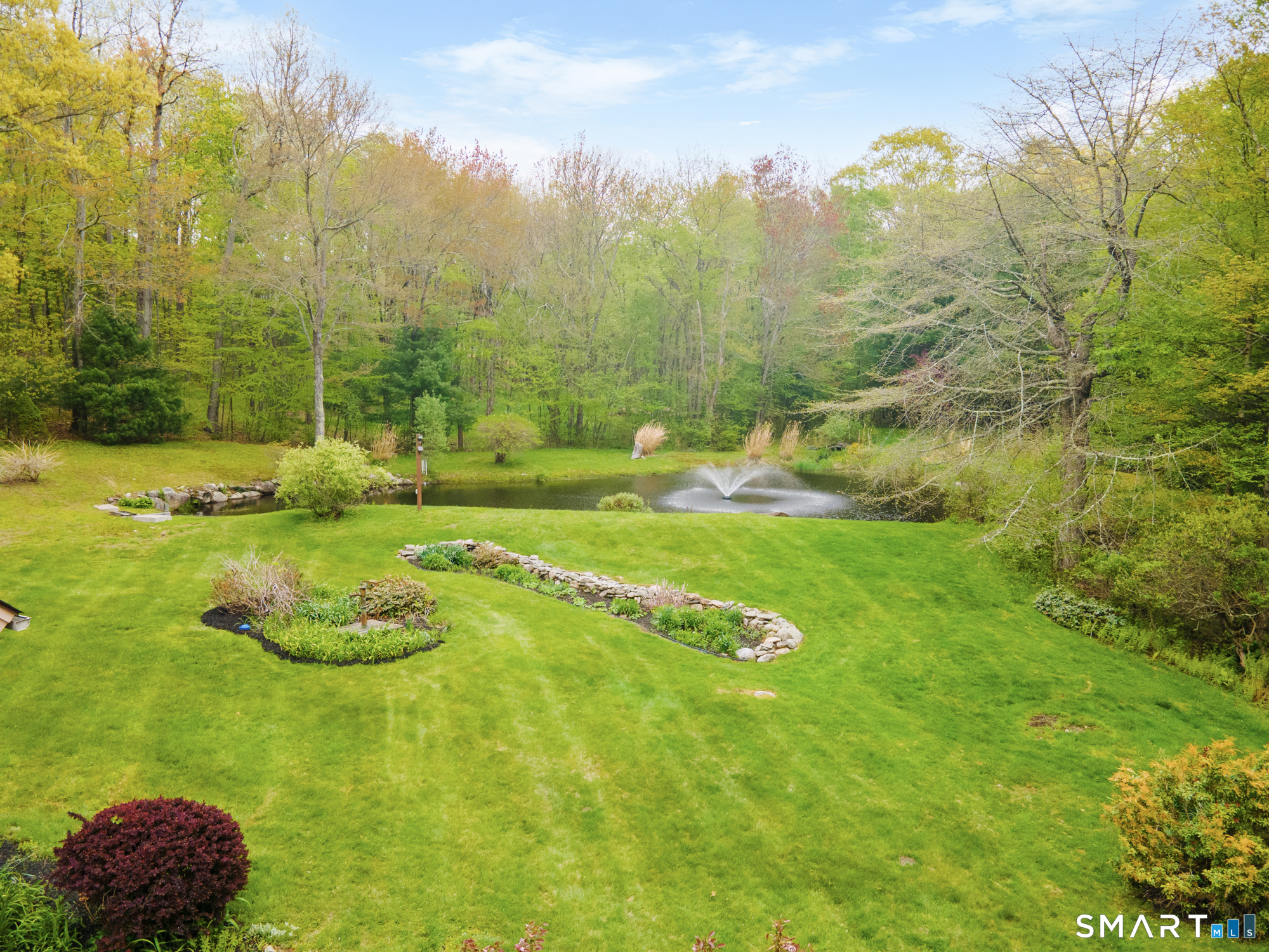 72 Wild Cat Hill Road Harwinton, CT 06791 - Photo 32 of 40 a view of a swimming pool with a yard