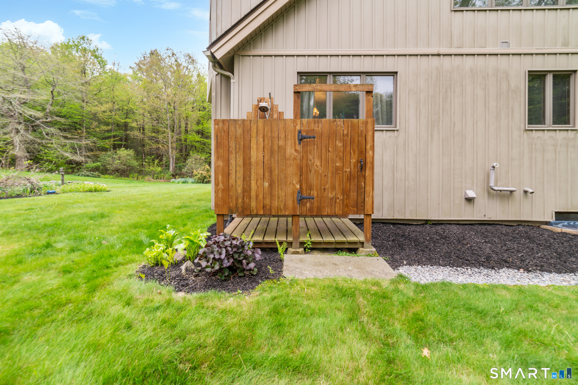 72 Wild Cat Hill Road Harwinton, CT 06791 - Photo 34 of 40 a backyard of a house with lots of green space
