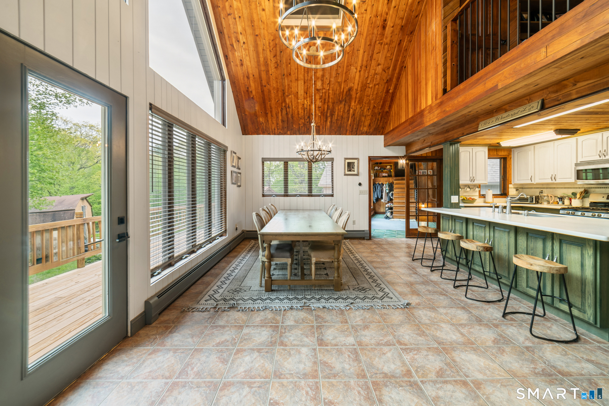 72 Wild Cat Hill Road Harwinton, CT 06791 - Photo 7 of 40 a dining room with furniture and a floor to ceiling window