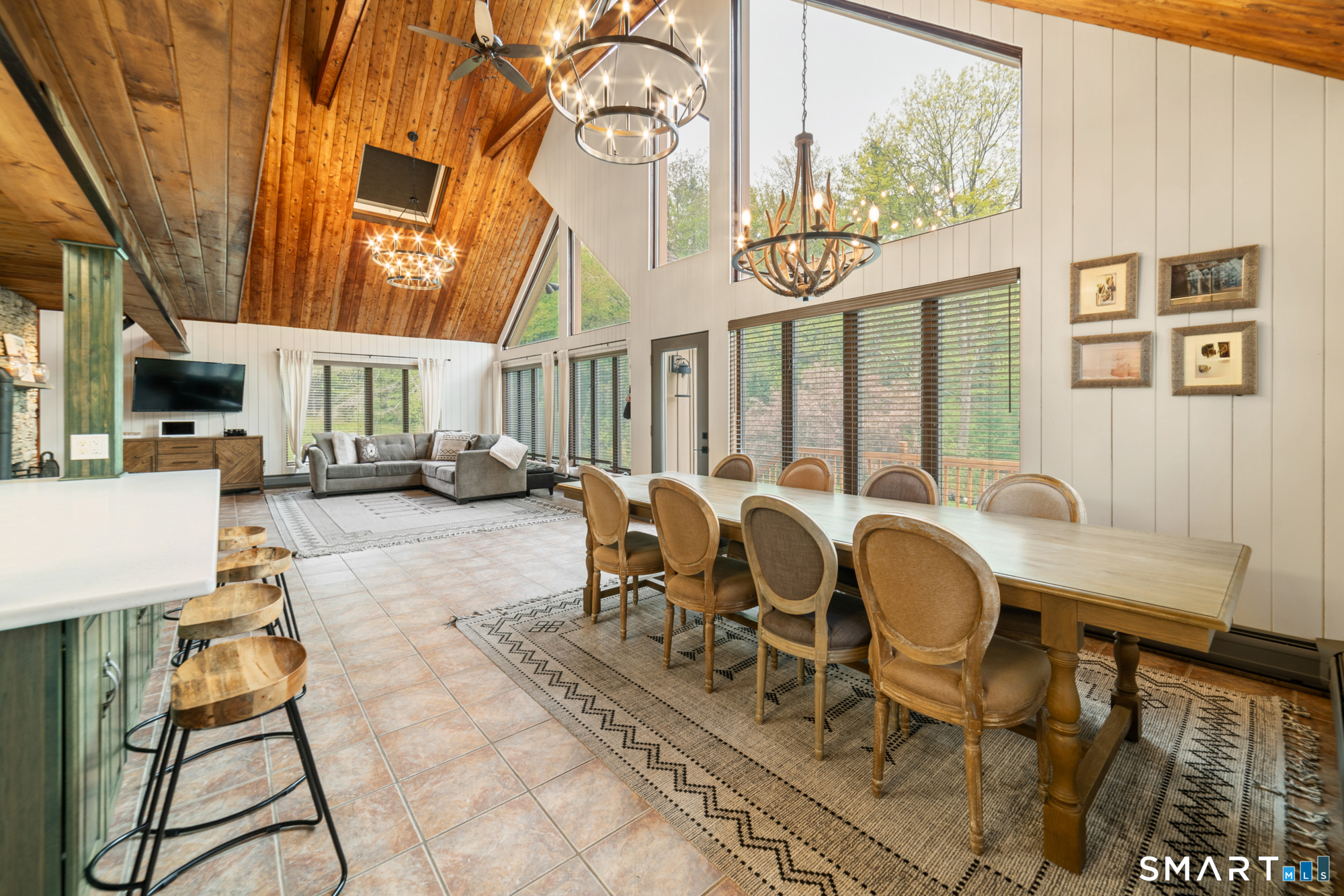 72 Wild Cat Hill Road Harwinton, CT 06791 - Photo 9 of 40 a view of a patio with table and chairs with wooden floor and fence