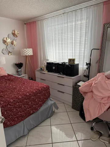 a bed room with a bed and a window