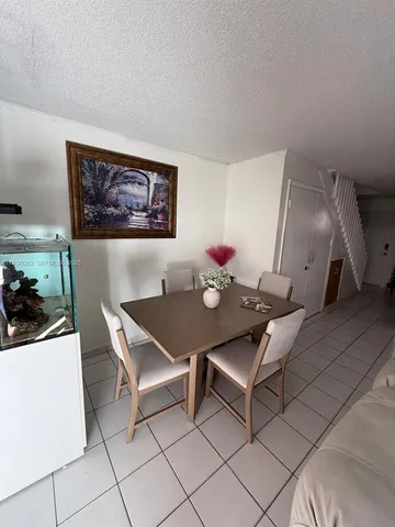 a view of a workspace with furniture