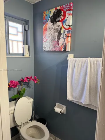 a bathroom with a toilet and a sink