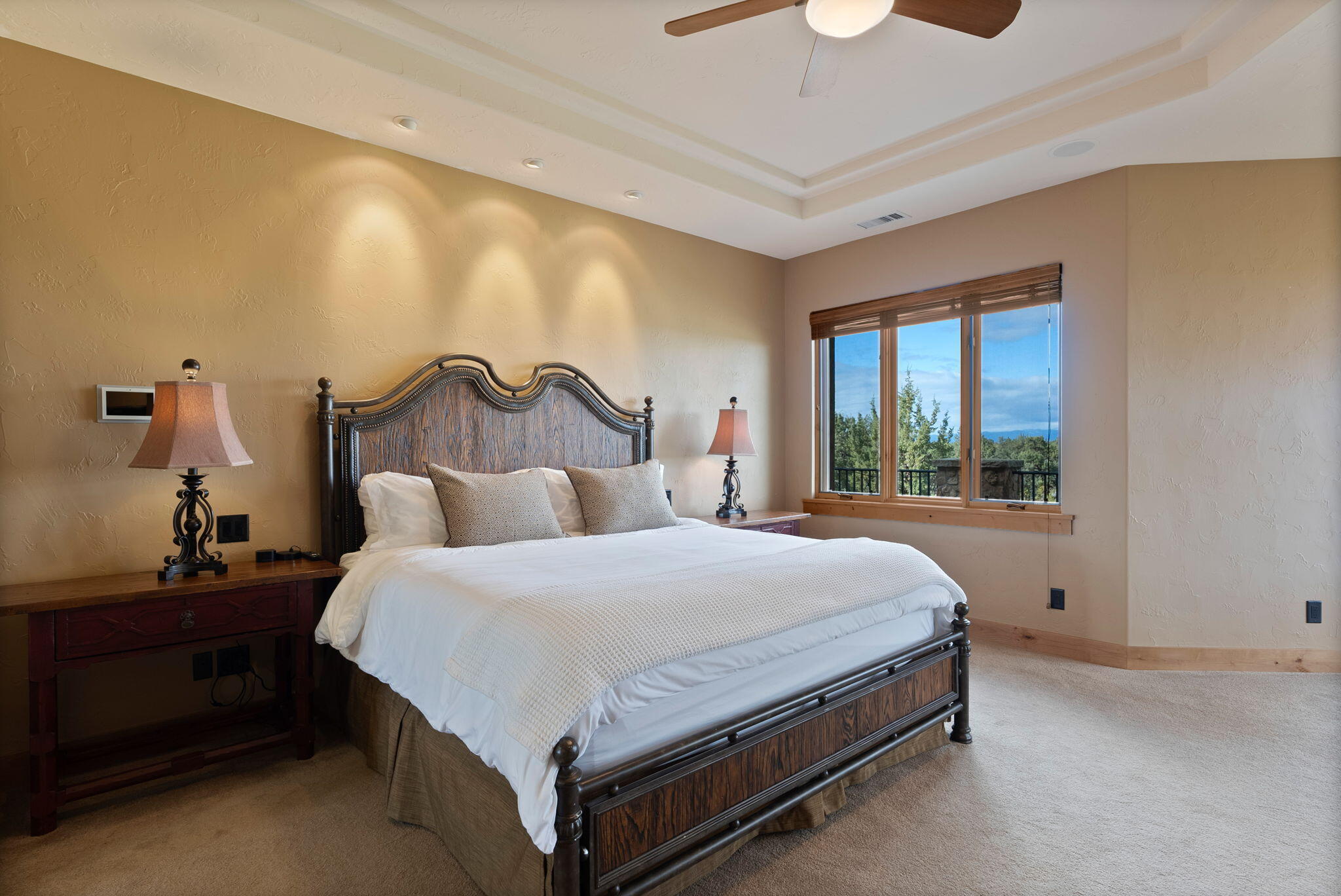 22887 Ghost Tree Lane Bend, OR 97701 - Photo 47 of 97 The stunning primary suite boasts a fireplace, sitting area, coffee bar, spa-like bath, private balcony & expansive views.
