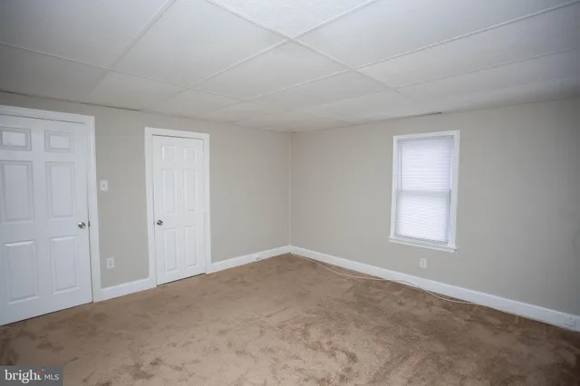 a view of an empty room and entryway