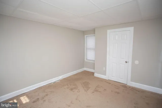 a view of an empty room and window