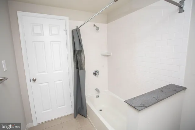 a bathroom with a glass shower door