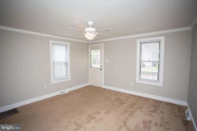 a view of an empty room with a window