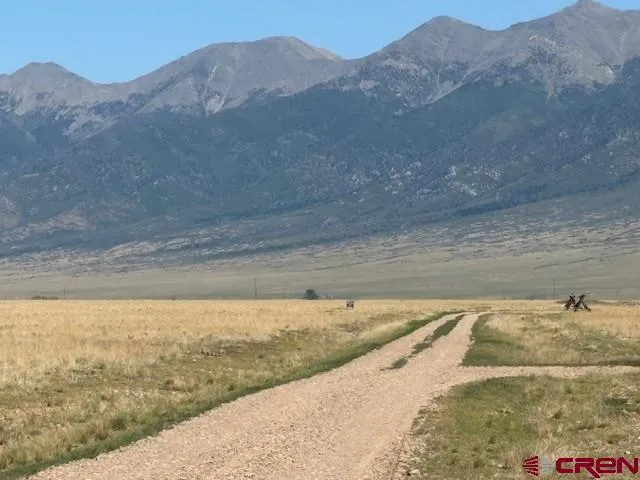 a view of a dry yard with mountain