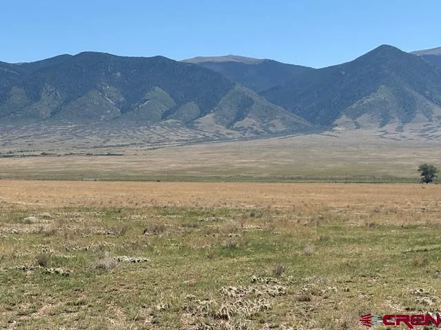 a view of ocean and a mountain