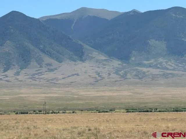 a view of a dry yard with mountain