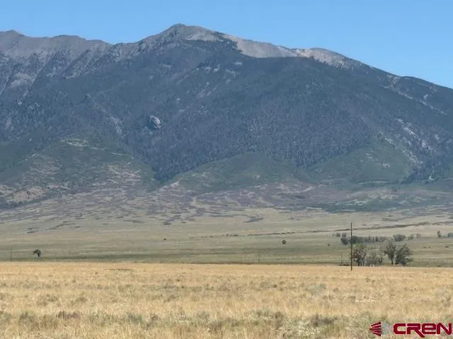 a view of a yard with mountain and mountain view