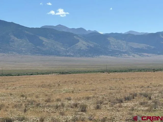a view of ocean and mountains