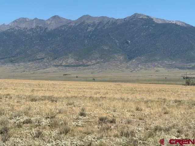 a view of a yard with a mountain