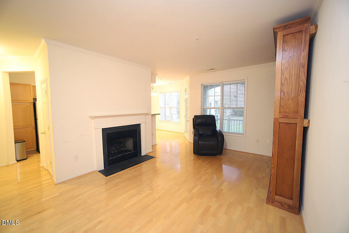 3161 Hemlock Forest Circle, Unit 101 Raleigh, NC 27612 - Photo 5 of 21 a view of a livingroom with a fireplace