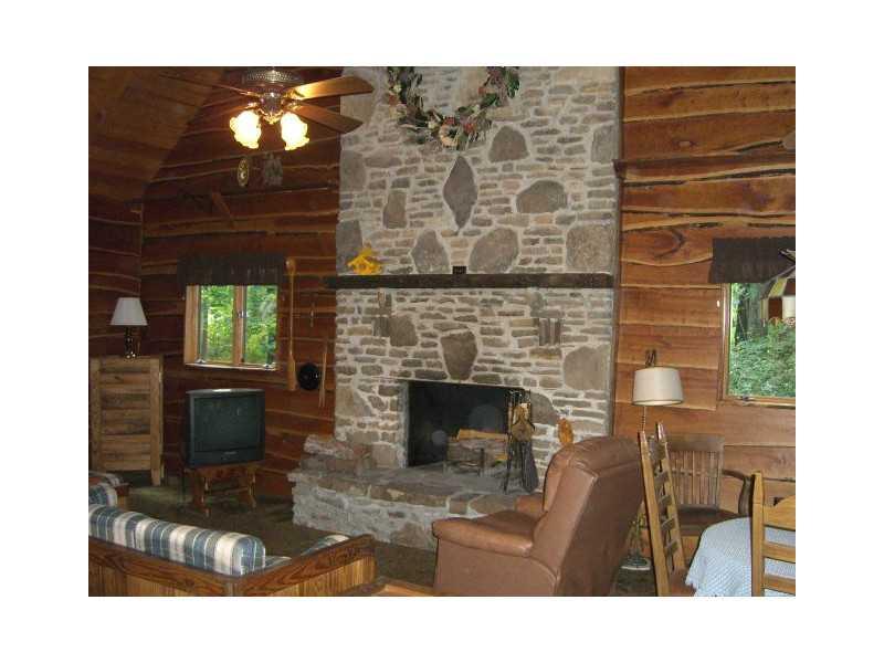 629 Rustic Ridge Road Champion, PA 15622 - Photo 8 of 25 Living Room. The mountain stone runs from floor to ceiling