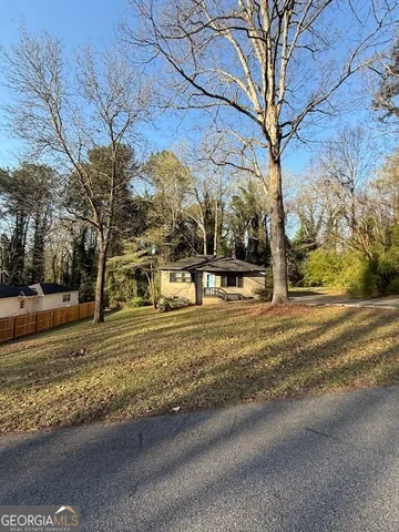 a view of street with large trees
