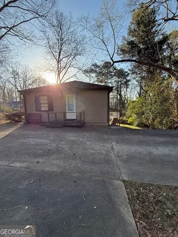 a view of a house with a tree
