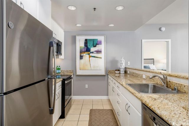 a bed room with a bed and a night stand