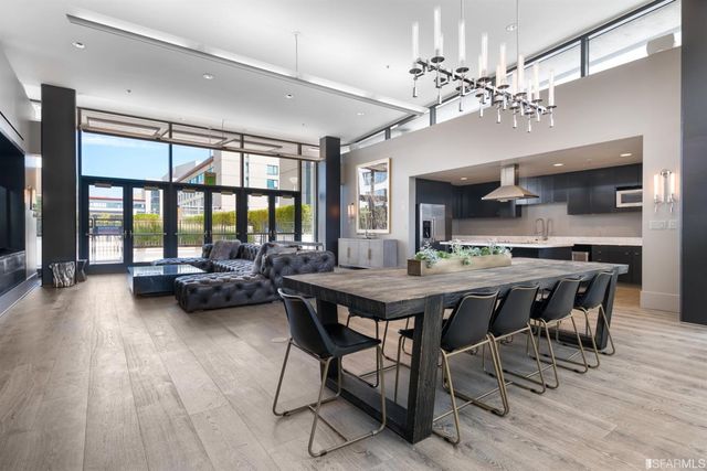 a view of a big building with a big yard and plants