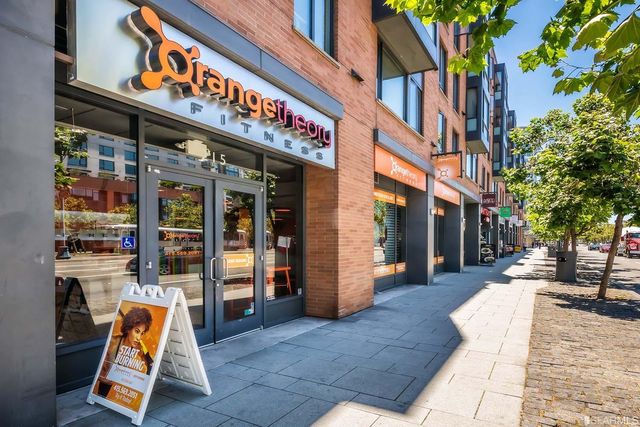 a view of a cafe with sitting area