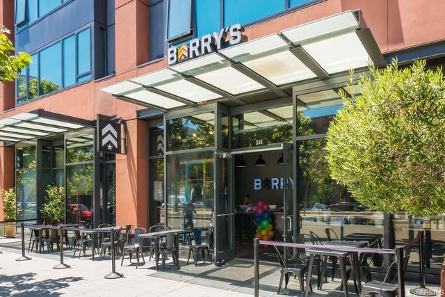 a front view of multi story residential apartment building with yard