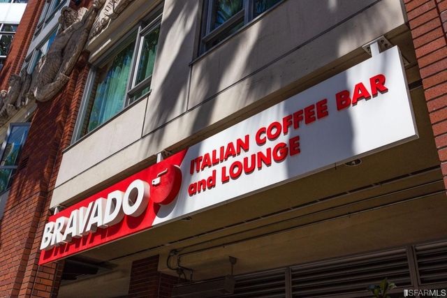 a view of a lake with boats and trees in the background