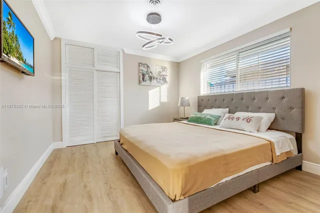 a bedroom with a bed and dresser