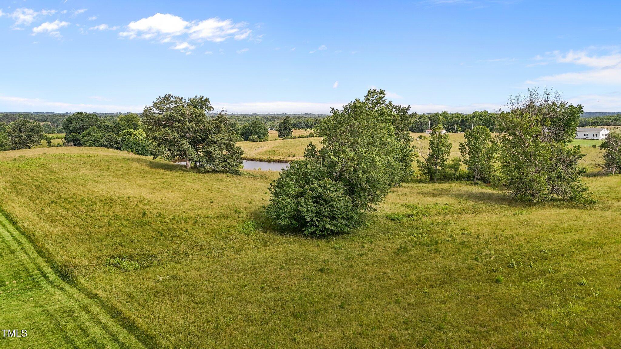 a view of a lake with a yard