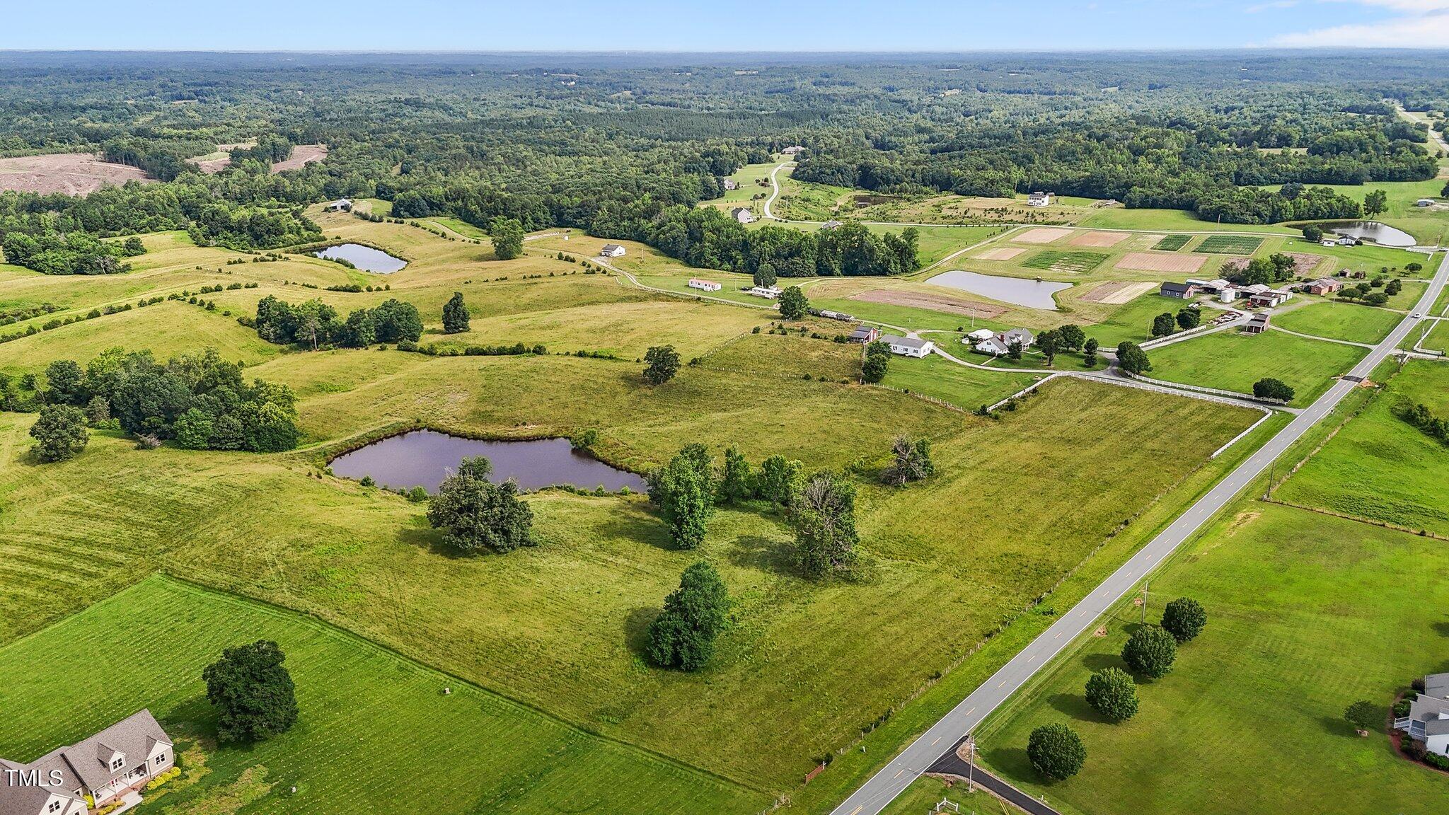 0 Corbett Ridge Road Mebane, NC 27302 - Photo 14 of 20 an aerial view of residential houses with outdoor space