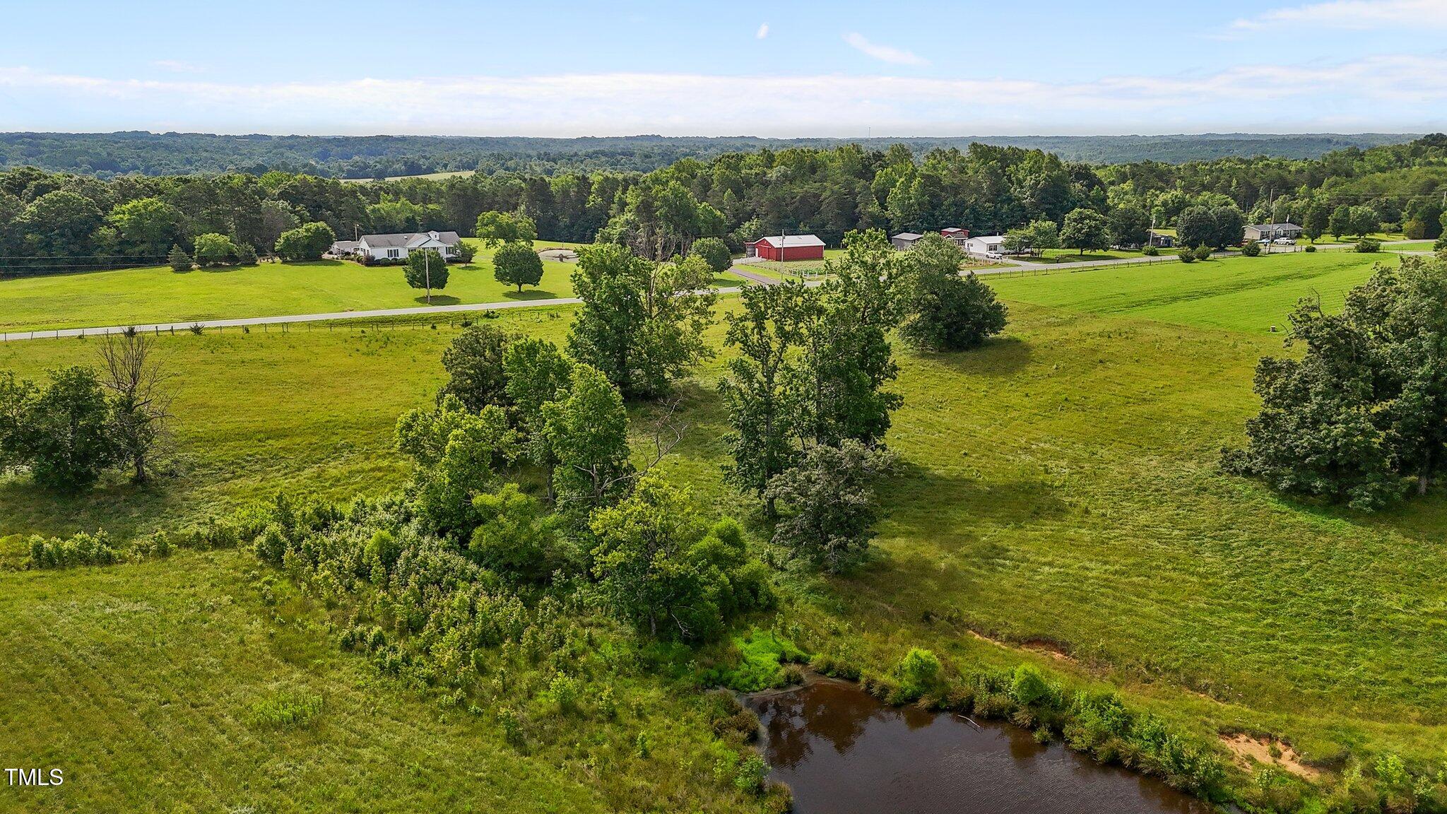 0 Corbett Ridge Road Mebane, NC 27302 - Photo 18 of 20 a view of a city with lots of residential buildings ocean and mountain view