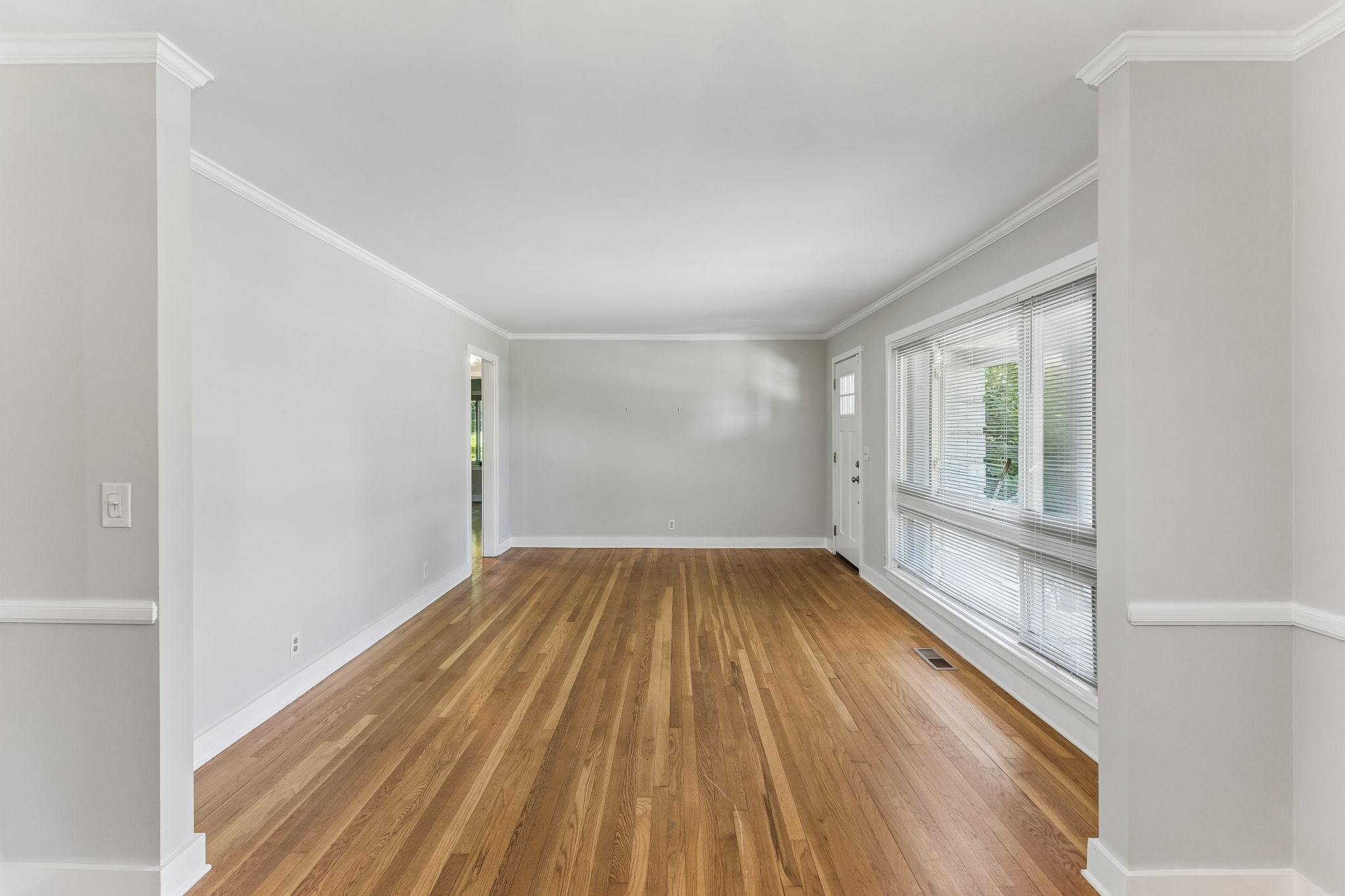 4425 Prescott Road Nashville, TN 37204 - Photo 4 of 36 a view of empty room with wooden floor and fan