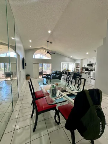 a living room with lots of furniture and a large window