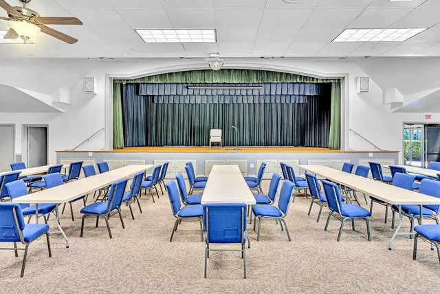 a group of people sitting at tables in a room