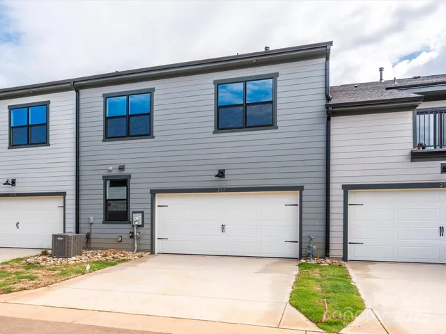 a front view of a house with a garage