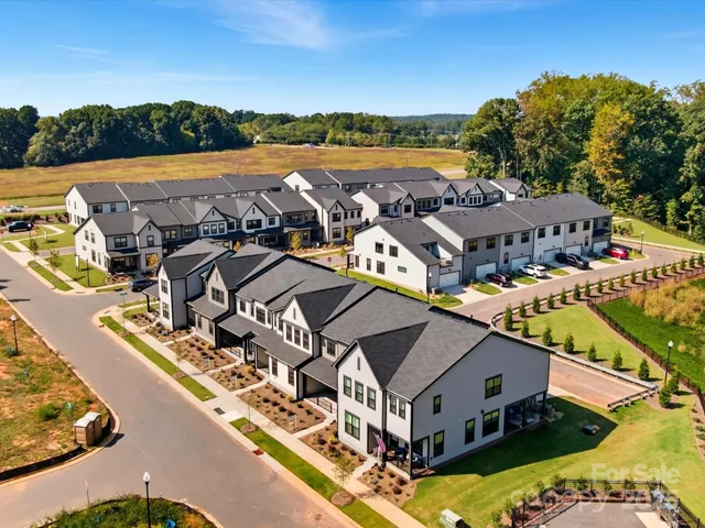 an aerial view of a house with a ocean view