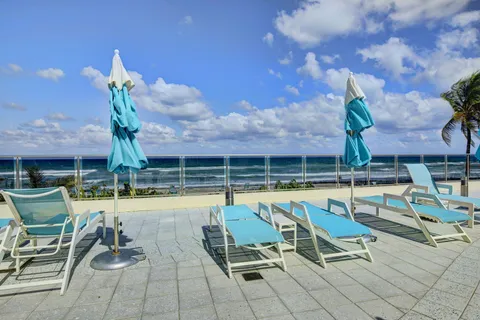 a view of a swimming pool with chairs