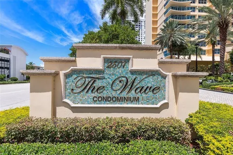 a view of a chairs and table in a backyard