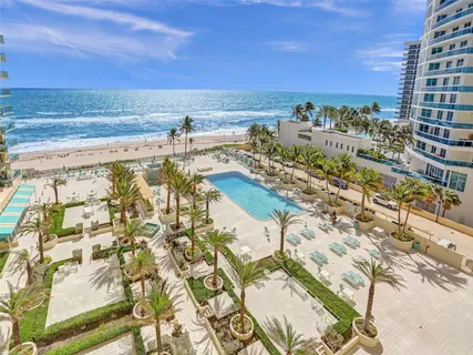 a view of swimming pool from a balcony