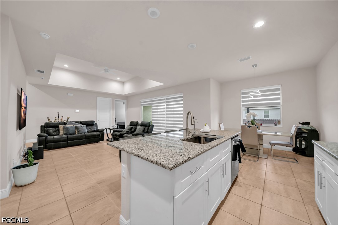 384 Neighborly Road LaBelle, FL 33935 - Photo 12 of 45 a large white kitchen with a counter top space a sink and appliances