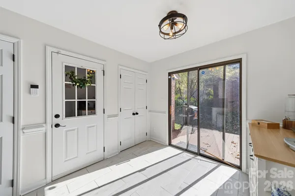 a view of an entryway with wooden floor