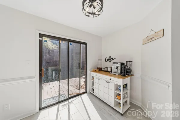 a kitchen with stainless steel appliances a counter top space cabinets and a window