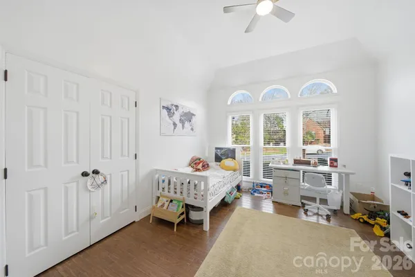 a bedroom with furniture and a window