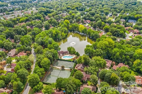 an aerial view of a house with outdoor space