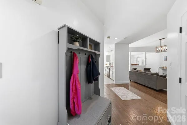 a living room with furniture and a walk in closet