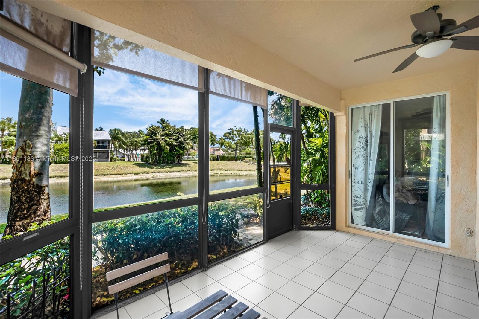 23158 Island View, Unit 1 Boca Raton, FL 33433 - Photo 14 of 39 a view of a glass door with a yard from a balcony