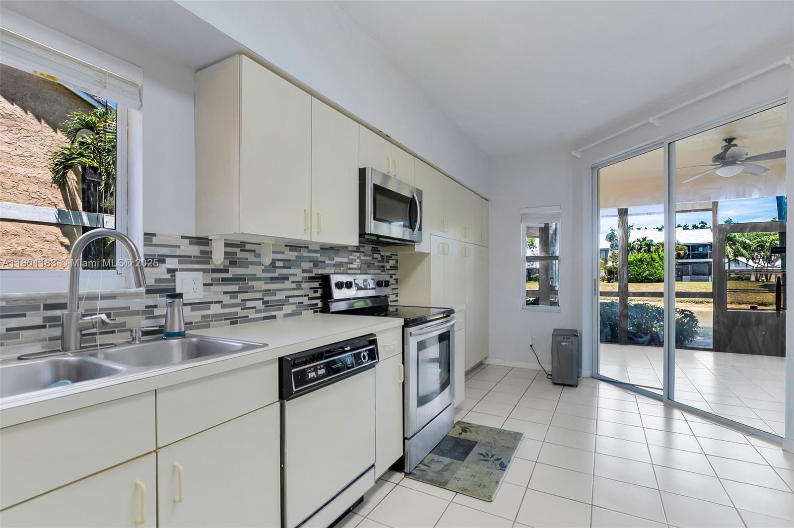 23158 Island View, Unit 1 Boca Raton, FL 33433 - Photo 20 of 39 a kitchen with a sink stove and refrigerator