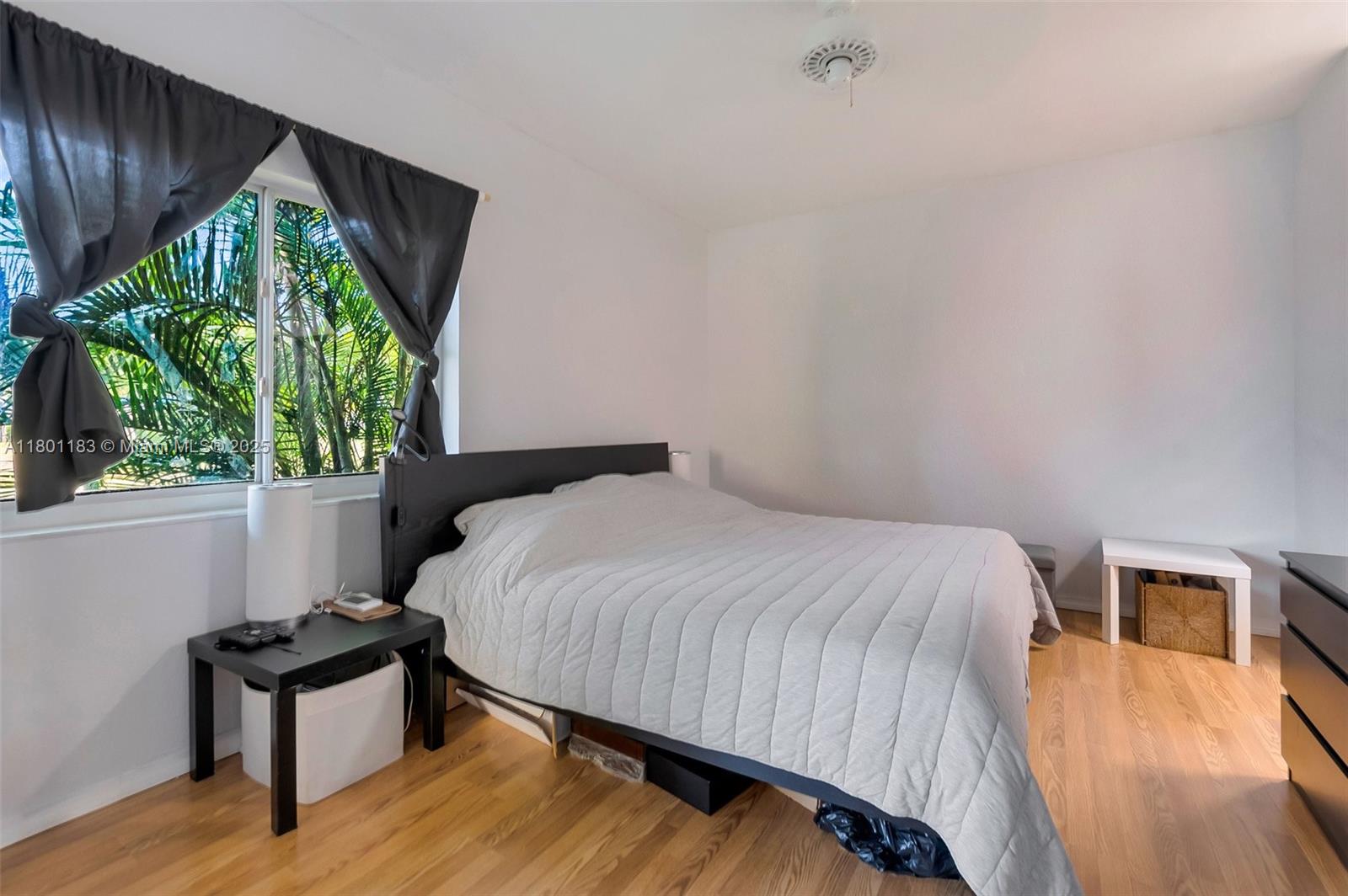 23158 Island View, Unit 1 Boca Raton, FL 33433 - Photo 2 of 39 a bedroom with a bed and a window