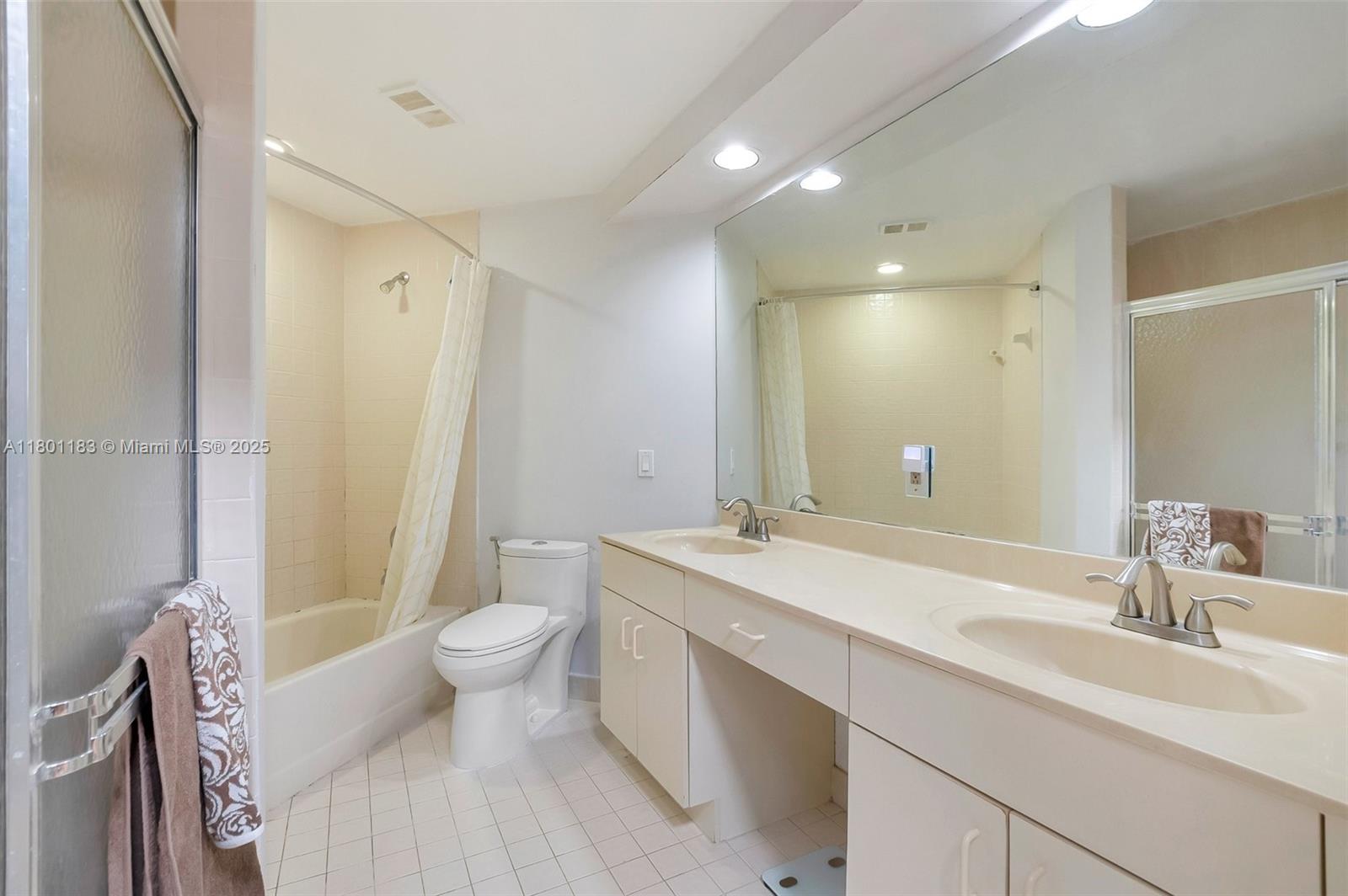 23158 Island View, Unit 1 Boca Raton, FL 33433 - Photo 5 of 39 a bathroom with a sink toilet and shower