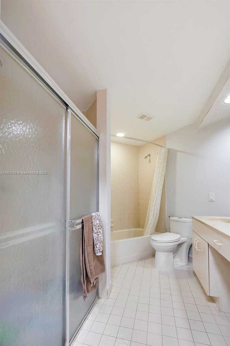 23158 Island View, Unit 1 Boca Raton, FL 33433 - Photo 6 of 39 a bathroom with a toilet and a shower